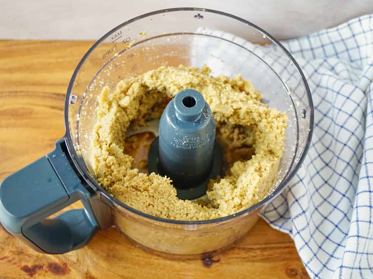 Partially blended walnuts in a food processor.