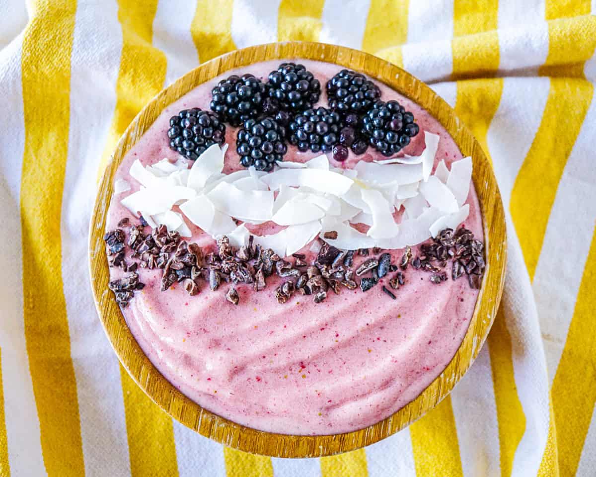 High collagen strawberry smoothie with blackberries, coconut flakes, and cacao nibs.