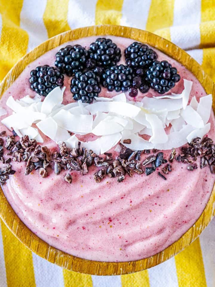 High collagen strawberry smoothie with blackberries, coconut flakes, and cacao nibs.